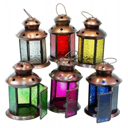 An assortment of moroccan inspired glass lanterns, each set with its own coloured panelling