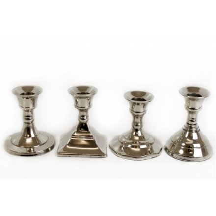 A stunning assortment of chrome candle sticks in classic designs with different shaped bases. 