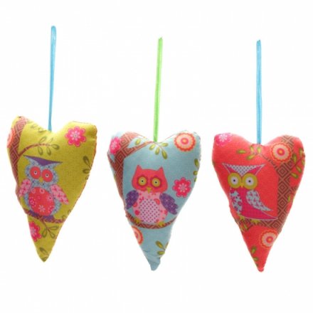 Fabric hanging hearts with a colourful and contemporary owl design with a patchwork of patterns and colourful ribbon. 