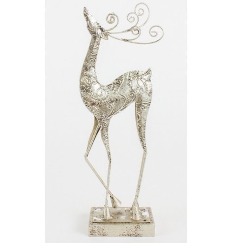 An elegant standing reindeer figure with curled antlers and a swirling decorative pattern.