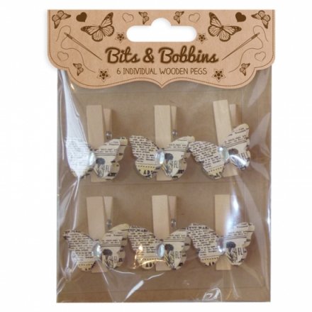 A pack of 6 vintage style butterfly craft pegs each with a gem.