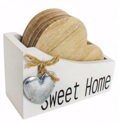 A chic set of heart coasters held in a white wooden box with 'Sweet Home' wording