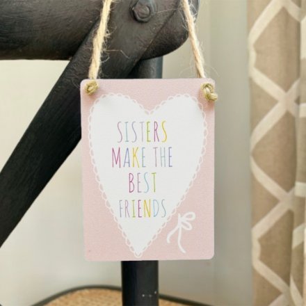 Pretty pastel sign with lace heart motif, multi-coloured sister text and jute string to hang. 