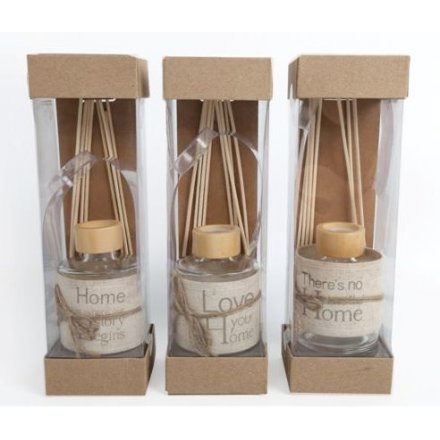 An assortment of scented reed diffusers with linen wrap and sweet wording