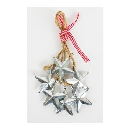 Rustic style string hung in a cluster with hanging metal stars on the end of each