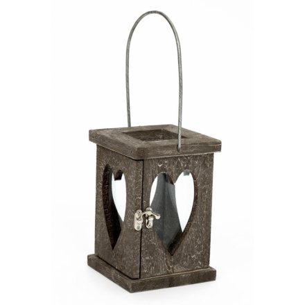 A chunky wooden lantern with heart glass and a grey washed finish