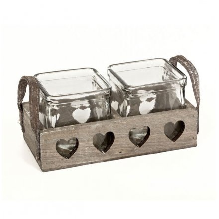 Square glass candle pots in a rustic wooden tray with heart cut outs