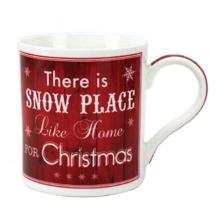 A vintage style red and white china mug reading 'There's snow place like home for Christmas'.
