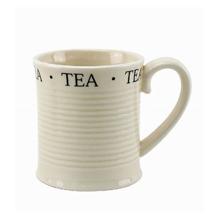 A cream ceramic mug with classic TEA script.