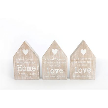 An assortment of three house shaped wooden signs with sentimental quote