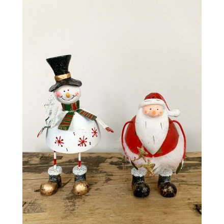 Vintage inspired standing Santa and Snowman figures with snowflake and star wands. 