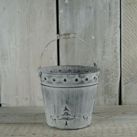 A festive whitewashed bucket with Christmas design