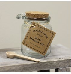 Glass storage jar with decorative cork lid and spoon to match