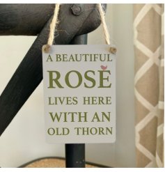 A mini metal garden sign with a rose slogan and jute string to hang.