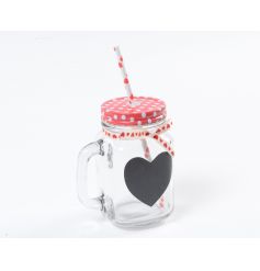 A unique mason style drinking glass with metal polka dot lid, ribbon and heart chalkboard.