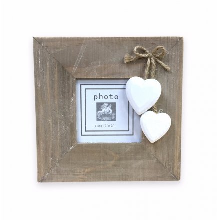 Wooden frame with shabby hanging hearts
