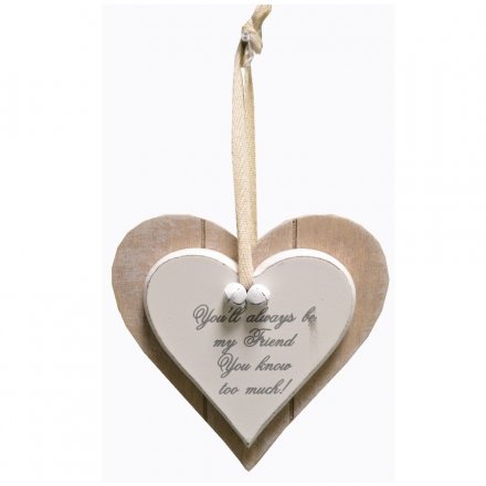 A hanging wooden heart sign with popular Friend quote