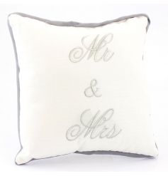A small cushion embroidered with Mr & Mrs slogan in silver.