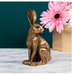 A stunning bronze hair ornament in sitting pose. A stylish home accessory.