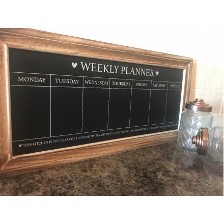 A weekly planner chalkboard with wooden frame 