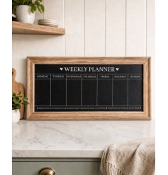 A shabby chic wooden chalkboard with weekly planner design