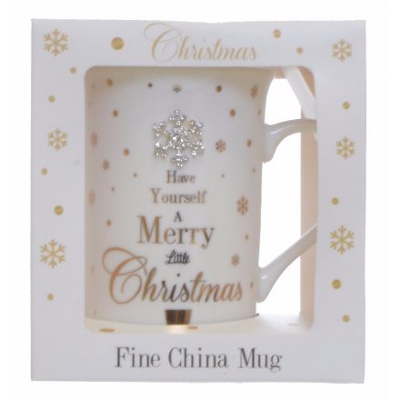 A glamorous Mad Dots Christmas mug with a heart gem and festive slogan.