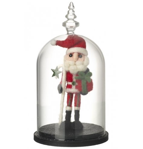 A tall, wonderfully detailed Santa figure stood within a vintage glass dome. 