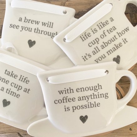 A mix of 4 tea and coffee slogan signs written onto ceramic cups. A great gift item!