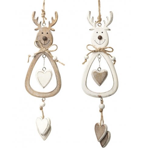 White washed and natural wooden reindeer decorations with heart charm hangers. 