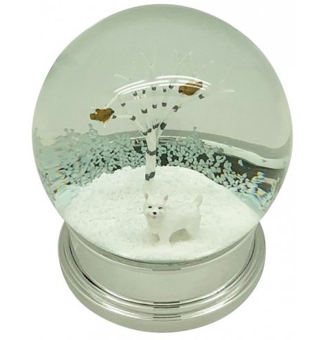 A classic snow globe with a silver base. Inside discover woodland twig trees, a Westie dog figurine and red bird.
