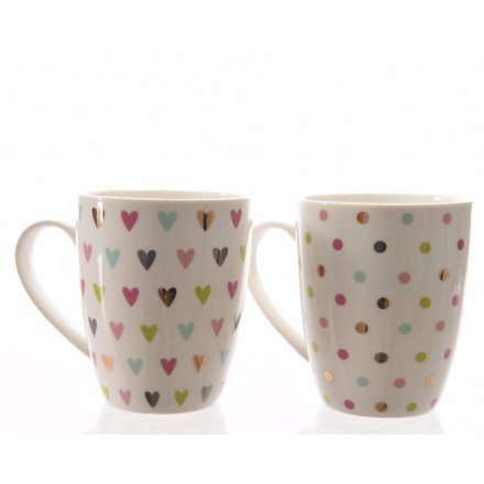 An assortment of 2 pretty multi-coloured heart and polka dot design mugs.