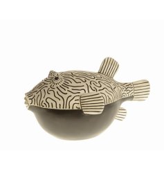 A stylish tropical fish ornament painted in contemporary black and white patterned colours.