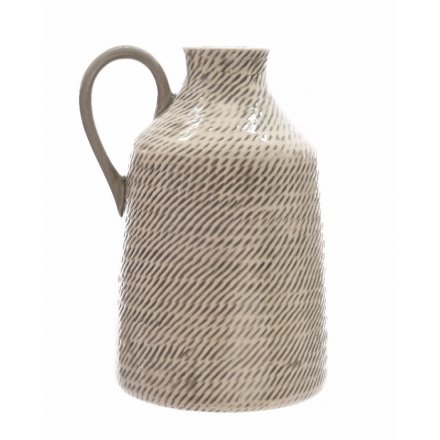 A stylish pitcher with a patterned finish. A country style item with a handmade appearance. 