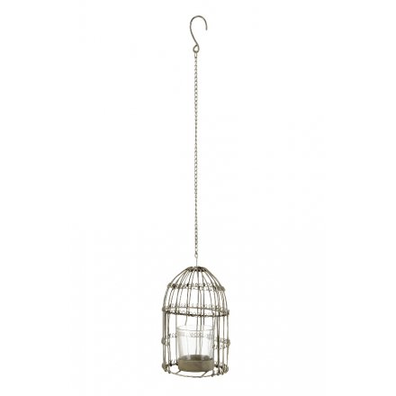 A rustic metal bird cage t-light holder with hanger. Ideal for garden and event decoration.