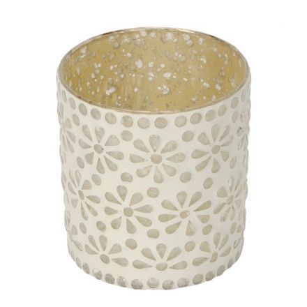 A decorative t-light holder with a cream floral pattern.