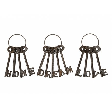 An assortment of 3 decorative keys, with each spelling LOVE, HOME or DREAM.