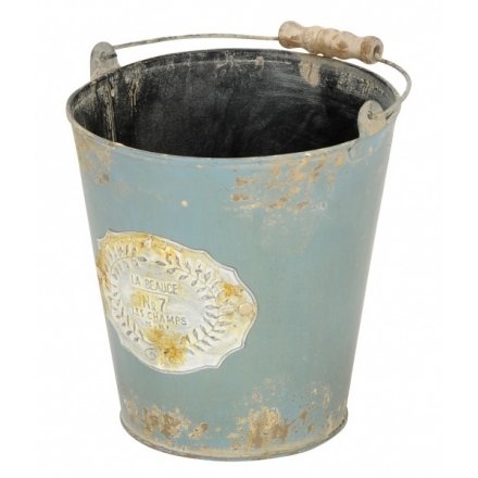 A vintage Parisian inspired metal bucket in green. Ideal for planting, display and storage.