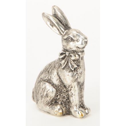 An antique style silver rabbit ornament with bow. A charming decorative accessory for the home.