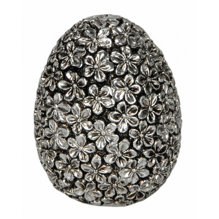 A stunning egg shaped ornament decorated with dainty flowers and finished in antique silver.
