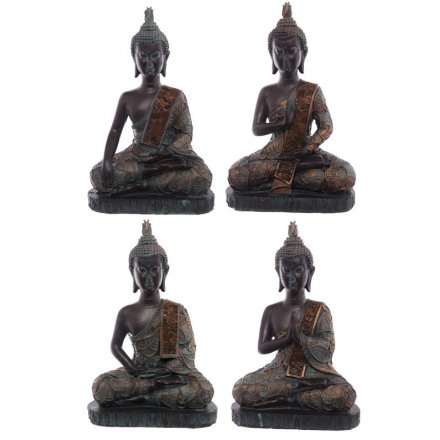A mix of stylish sitting buddha ornaments in rich copper and turquoise colours. A chic home accessory.