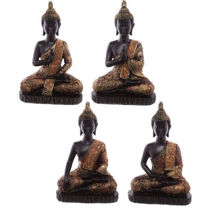 An assortment of 4 black and copper gold buddha figures. A stylish home accessory.