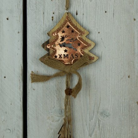 A rustic style wooden tree garland with a rustic bell, hessian bow and a decorative copper plate.