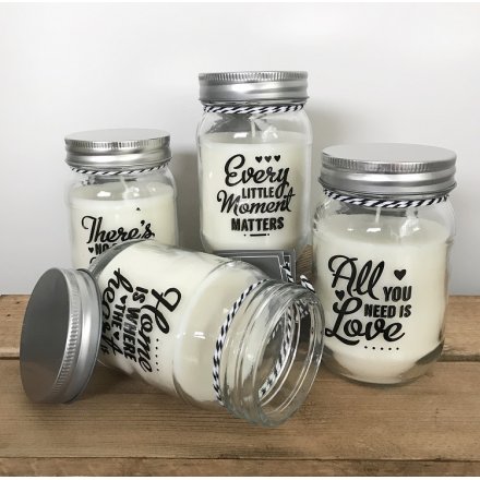 An assortment of 4 glass jars with sweet phrases