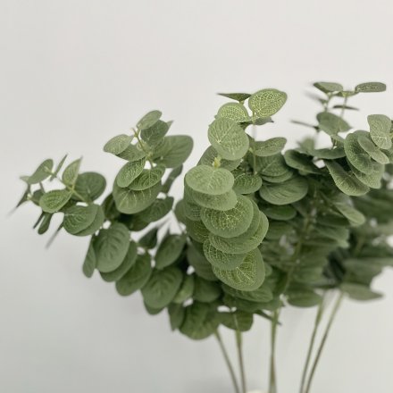 This artificial eucalyptus spray looks stylish displayed alone or as a filler for additional flowers.
