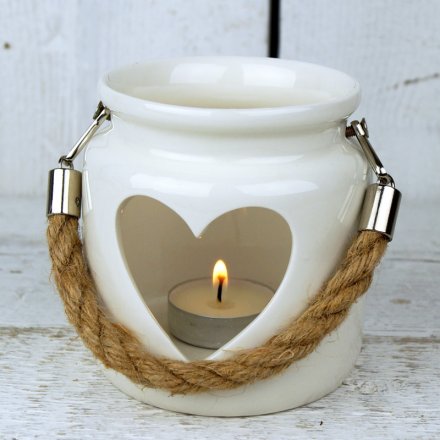  Add this delicate porcelain tlight holder to any table or windowsill to watch it produce a warm glow 