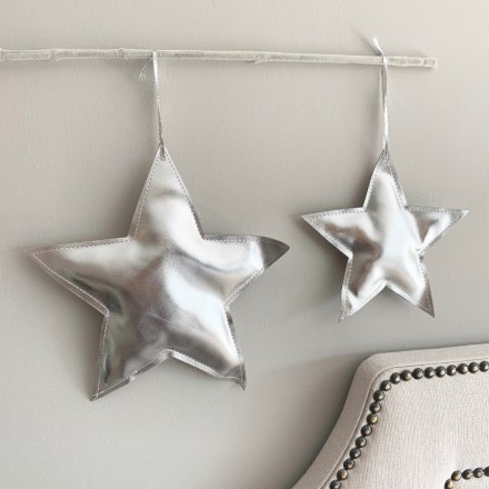 A stunning silver star decoration with shimmering fabric and a silver hanger.