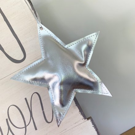 A shiny silver fabric star hanger. A unique festive item which is ideal for shop and window displays
