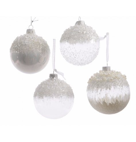 Dream of a white Christmas with this assortment of highly decorated glass baubles.