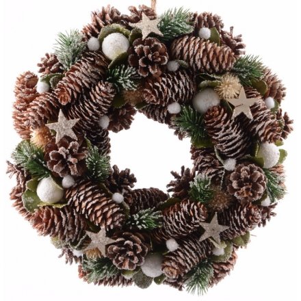 Add a delicate woodland feel to your front door this christmas with this beautiful pinecone and snowball based wreath