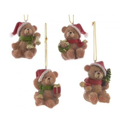 An assortment of traditional Christmas bear ornaments, each with a Santa hat and scarf in red and green colours.